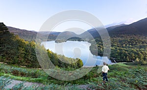 Hiker at Grasmere at dawn in Lake District