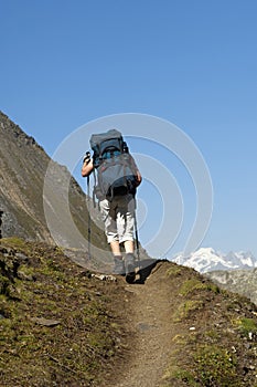 Hiker with a heavy backpack