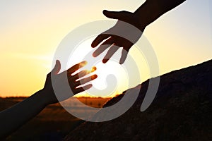 Hiker helping friend outdoors. Help and support concept