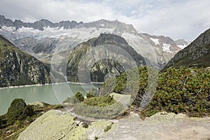 Hiker hikes through the breathtaking mountain scenery in the Alps