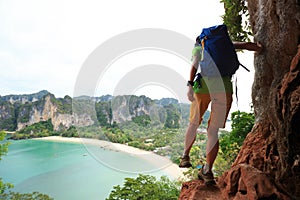 Hiker hiking at seaside cliff