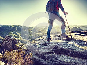 Hiker hold medicine stick,  injured knee fixed in knee feature