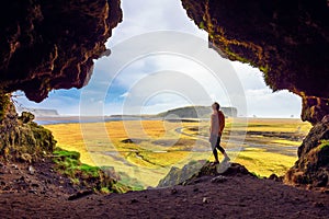 Hiker in the Loftsalahellir Cave near the village of Vik in Iceland