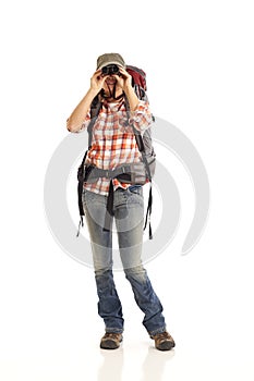 Hiker looking through binoculars
