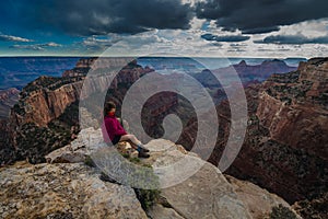 Hiker looking down Cape Royal Overlook Grand Canyon North Rim Wotans Throne