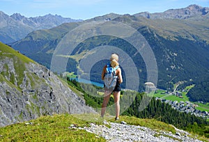 Hiker looks at the alpine city Davos