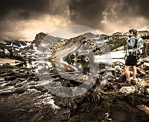 Hiker looks at Lake Isabelle Brainard Lake Recreation Area