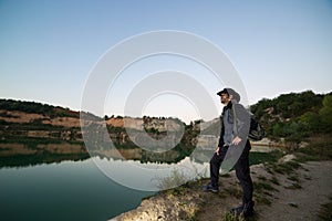 Hiker man with backpack at dawn