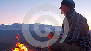 hiker man enjoying nature sitting at camp site