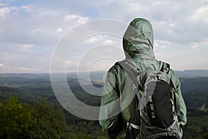 Hiker man enjoying view at nature with backpack.
