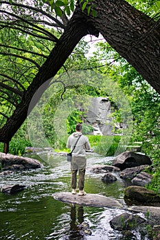 hiker man enjoying view of river in canyon