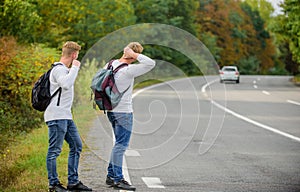 Hiker man on road. Way of travelling. Just friends and road ahead. feel the freedom. Travelling with friends. Travel by