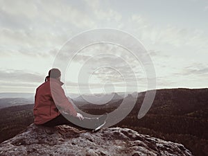 Hiker sit on summit of the mountain