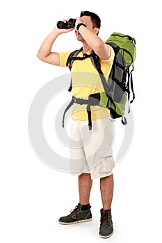 Hiker man tourist looking with binoculars