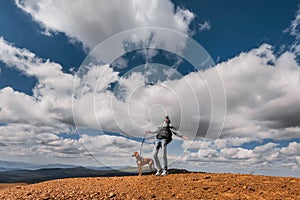 Hiker Man with Vizsla Dog at Mountain Top