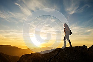 Hiker meets the sunset on the Moro rock in Sequoia national park, California, USA