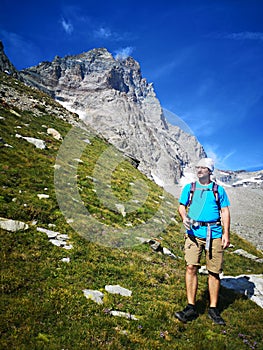 Hiker with Monte Cervino - Matterhorn Peak in the background