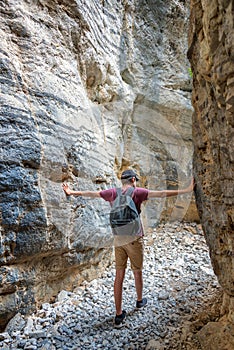 Hiker in a narrow trail of Imbros gorge, Crete Greece photo