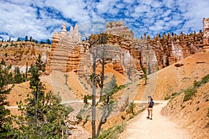 Hiker on the navajo loop trail in the bryce canyon national park in summer