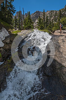 Hiker near the Waterfall Colorado Rockies