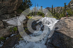 Hiker near the Waterfall Colorado Rockies