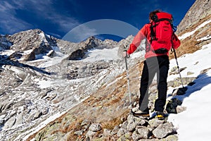 Hiker observing a high mountain panorama