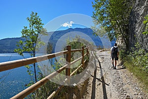 Hiker at old ponale road, adventurous trail, above garda lake italy