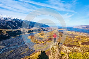 Hiker Overlooking Glacier River from Thorsmork in Southern Iceland