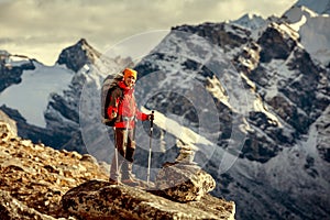 Hiker posing at camera on the trek in Himalayas