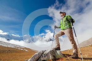 Hiker posing at camera on the trek in Himalayas, Nepal