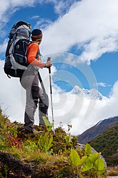 Hiker posing at camera on the trek in Himalayas, Nepal