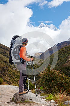 Hiker posing at camera on the trek in Himalayas, Nepal