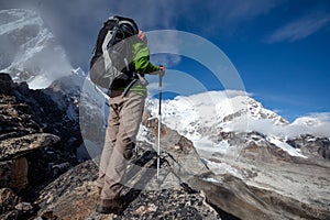 Hiker posing at camera on the trek in Himalayas, Nepal