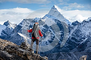 Hiker posing at camera on the trek in Himalayas, Nepal