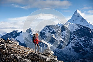 Hiker posing at camera on the trek in Himalayas, Nepal