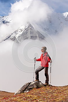 Hiker posing at camera on the trek in Himalayas, Nepal