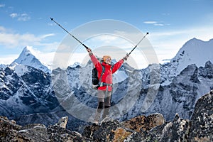 Hiker posing at camera on the trek in Himalayas, Nepal