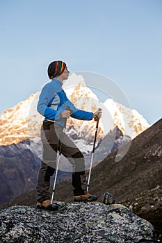 Hiker posing at camera on the trek in Himalayas, Nepal