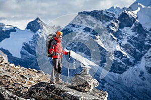 Hiker posing at camera on the trek in Himalayas, Nepal