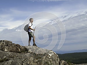 Hiker reaching the summit