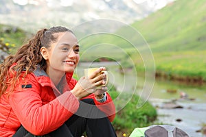 Hiker resting drinking in nature