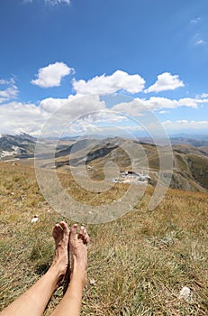 hiker while resting after the long walk in the Apennine mountains in central Italy