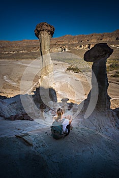 Hiker resting looking at Wahweap Hoodoos near Kanab