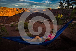 Hiker rests on a hammock admiring the sunset East Fork Shafer Ca