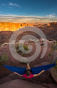 Hiker rests on a hammock admiring the sunset East Fork Shafer Ca