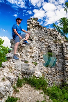 Hiker on ruins of castle Zniev, Slovakia photo