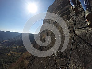 Hiker`s feet climbing the Pedra do Baú