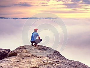 Hiker on sharp cliff of sandstone rock in rock empires park photo