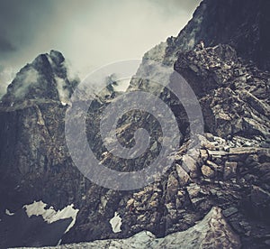 Hiker sitting on a mountain