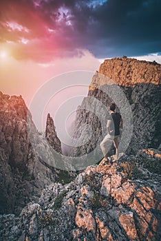 Hiker standing above the mountain canyon. Instagram stylization